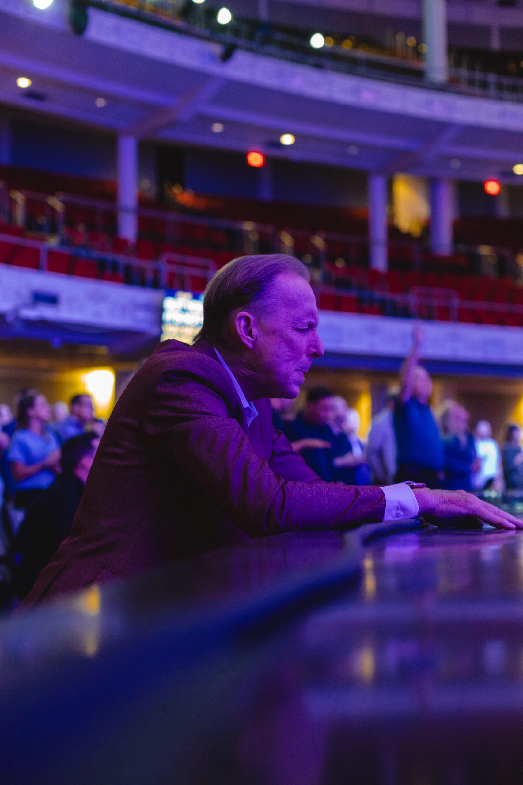 Larry Stockstill is knelt at the altar praying